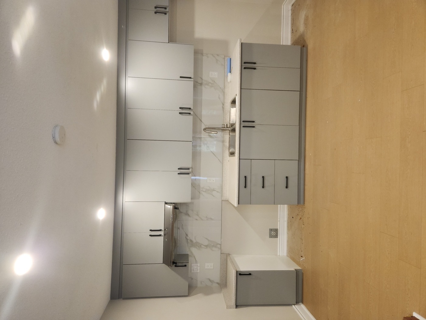 Grey kitchen in a renovated rental suite