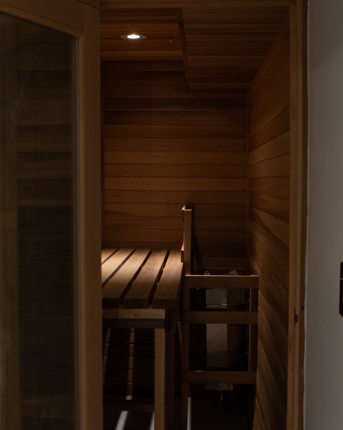 Cedar sauna with a single warm downlight