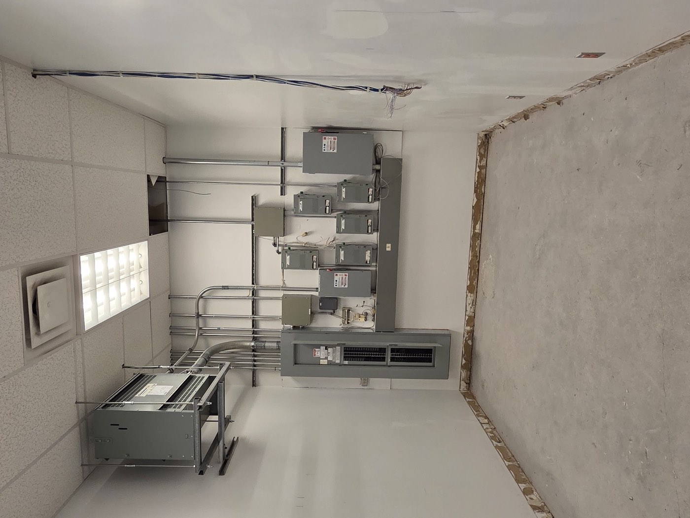 Commercial electrical room with new panels and conduit